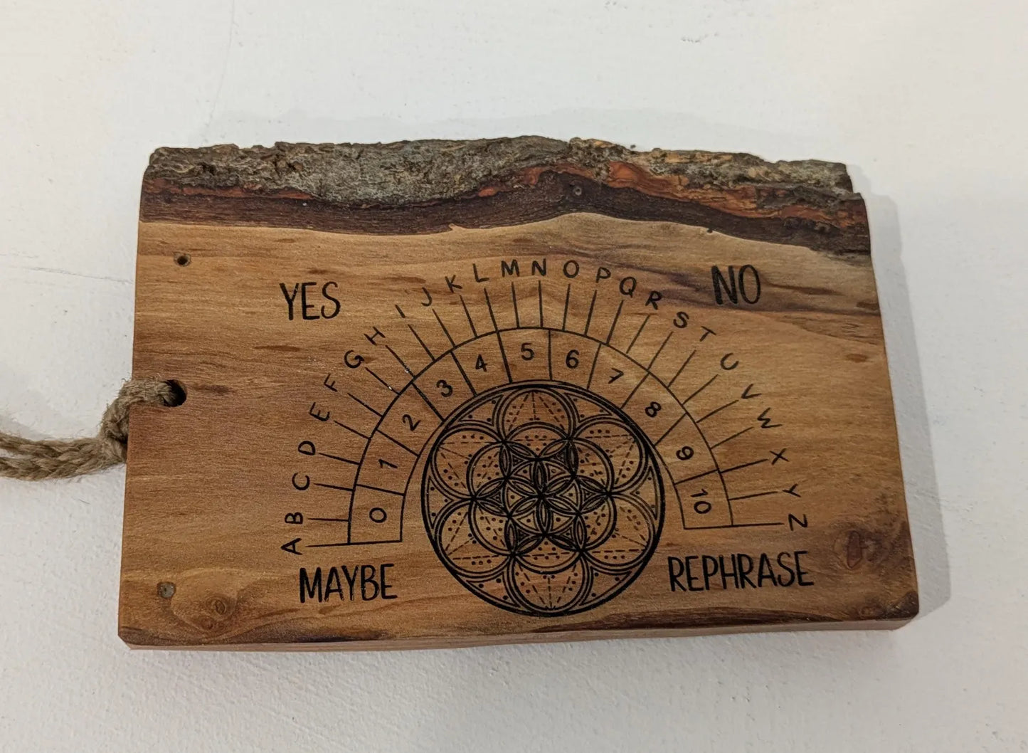 Alder wood hanging alphabet pendulum board with incense holder.