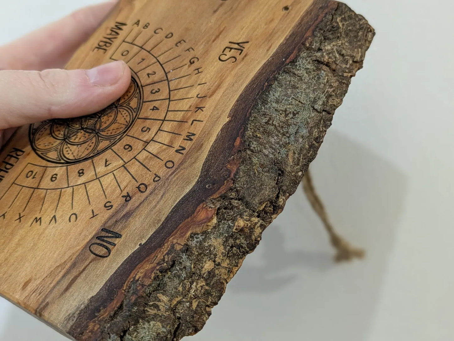Alder wood hanging alphabet pendulum board with incense holder.