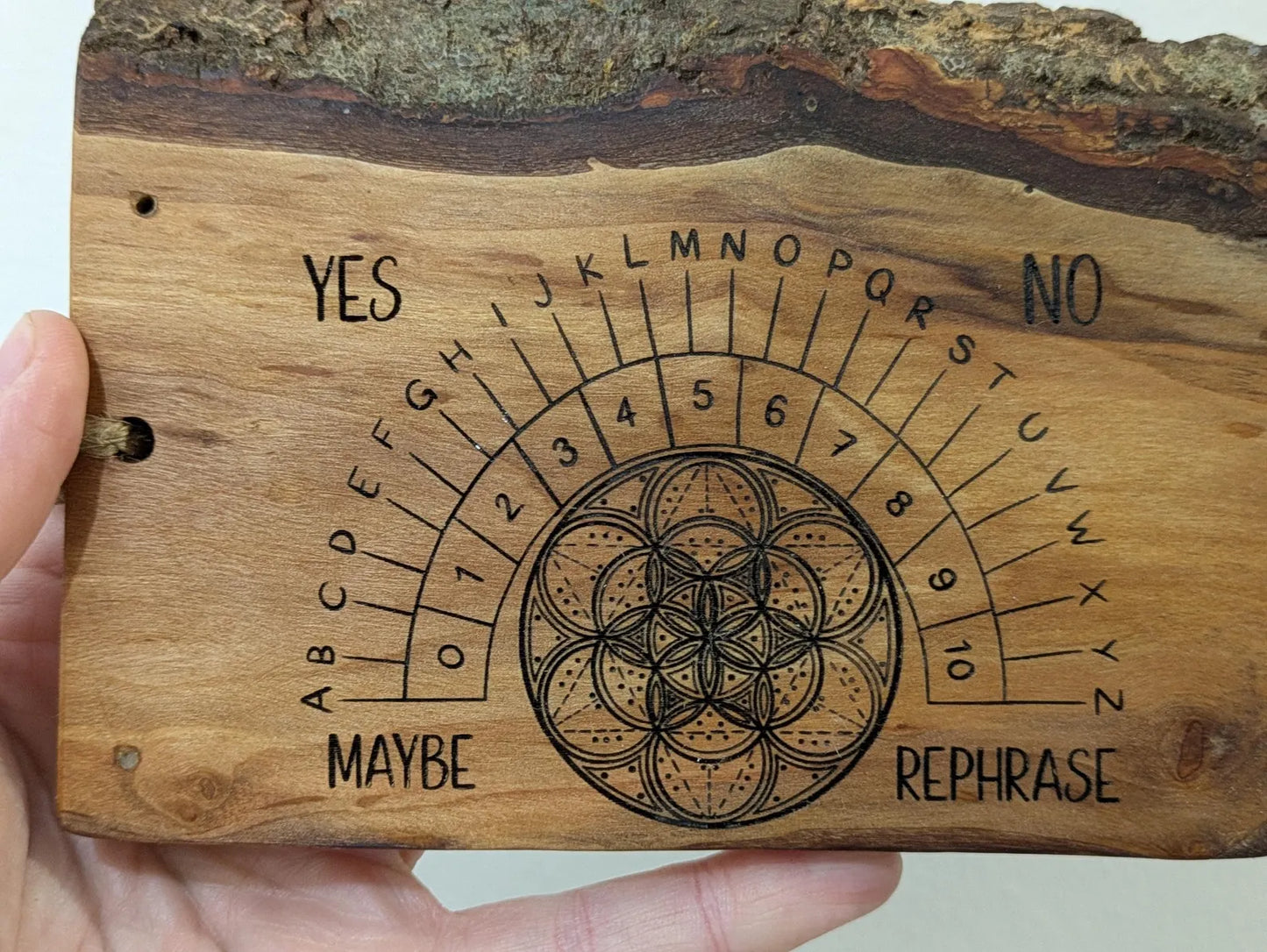 Alder wood hanging alphabet pendulum board with incense holder.
