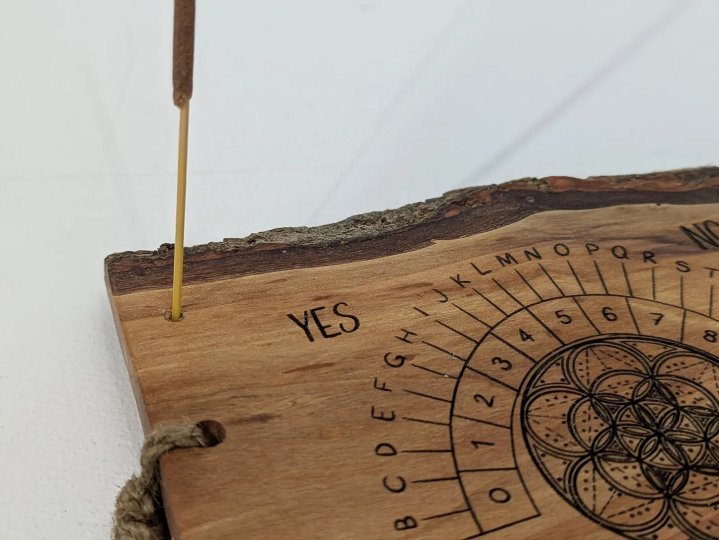 Alder wood hanging alphabet pendulum board with incense holder.