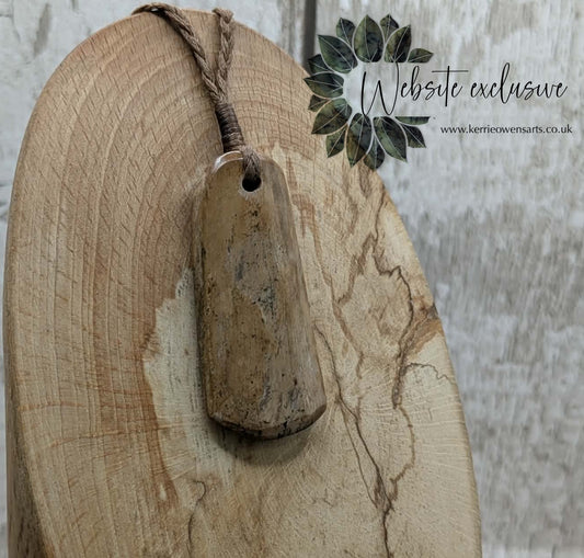 Stable British mammoth ivory trust pendant from Oxfordshire.