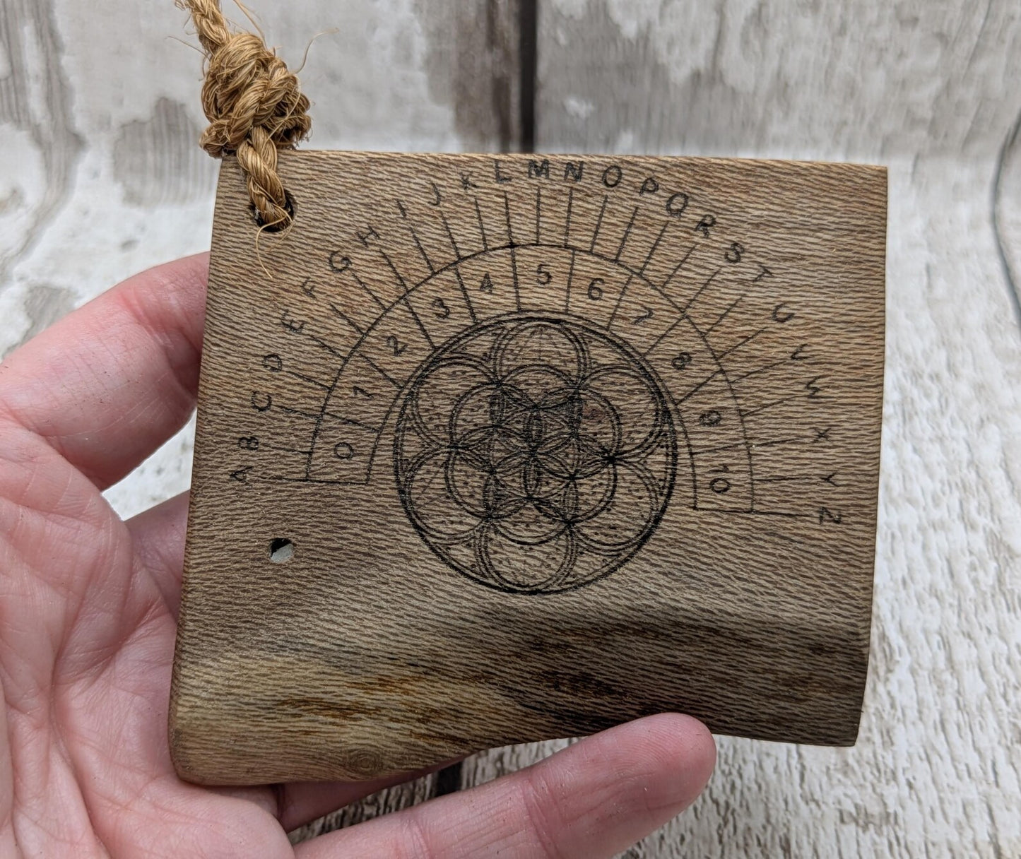 Lace wood mini pocket sized alphabet dowsing board with waney edge.