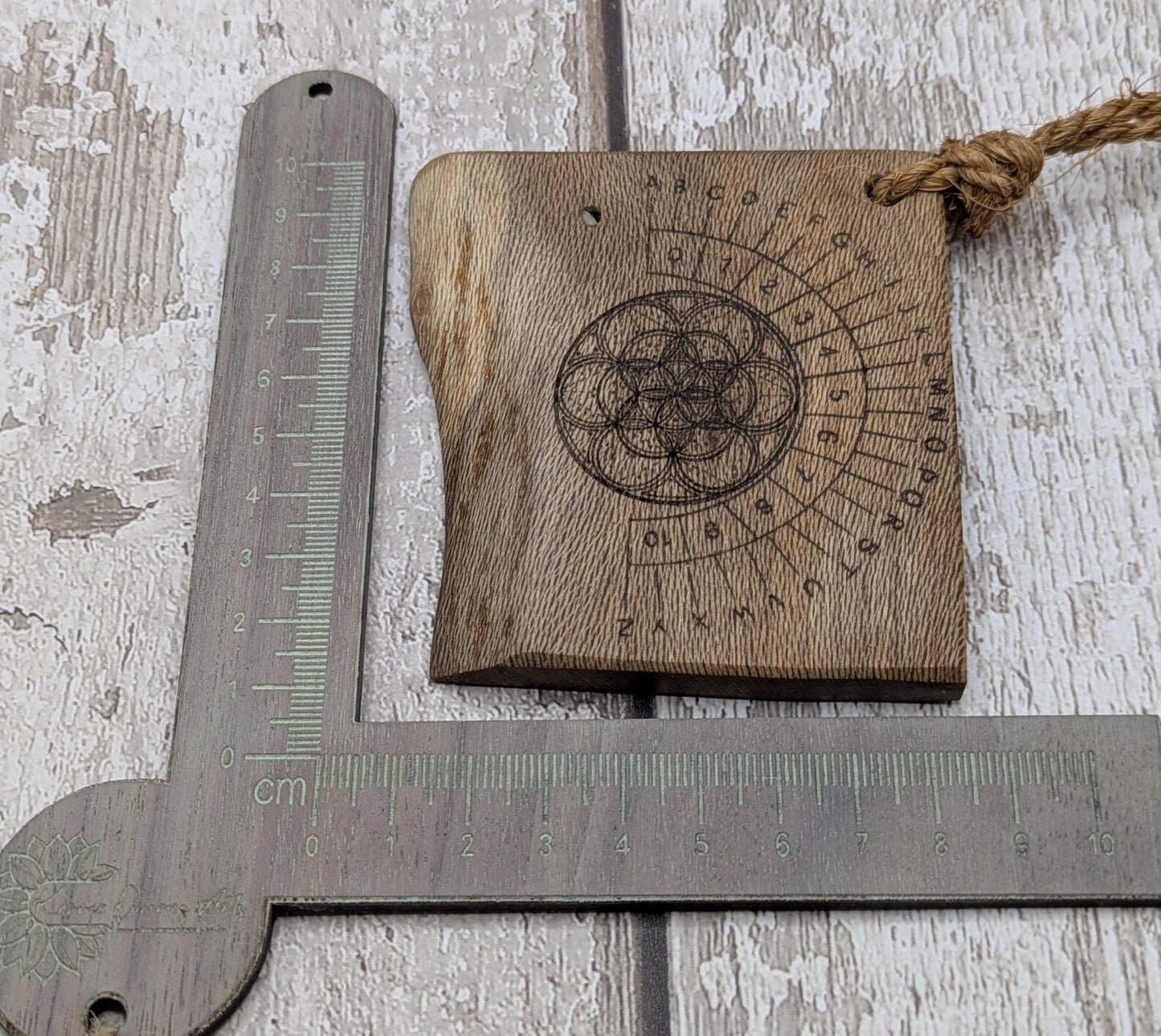 Lace wood mini pocket sized alphabet dowsing board with waney edge.