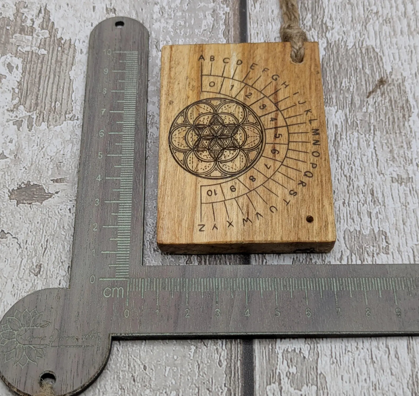 Lime wood pocket sized mini alphabet pendulum dowsing board.