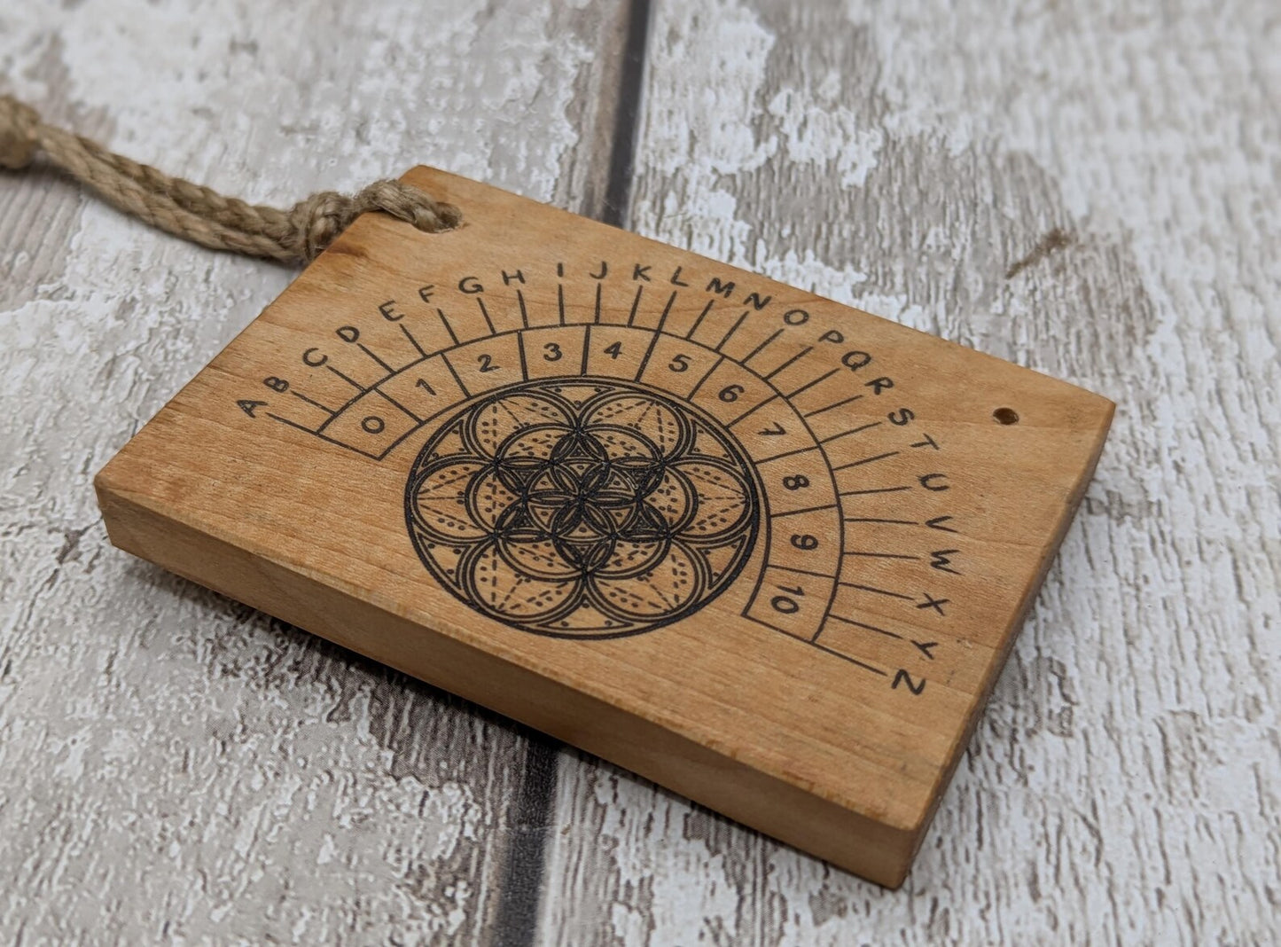 Alder wood mini pocket sized alphabet dowsing pendulum board.