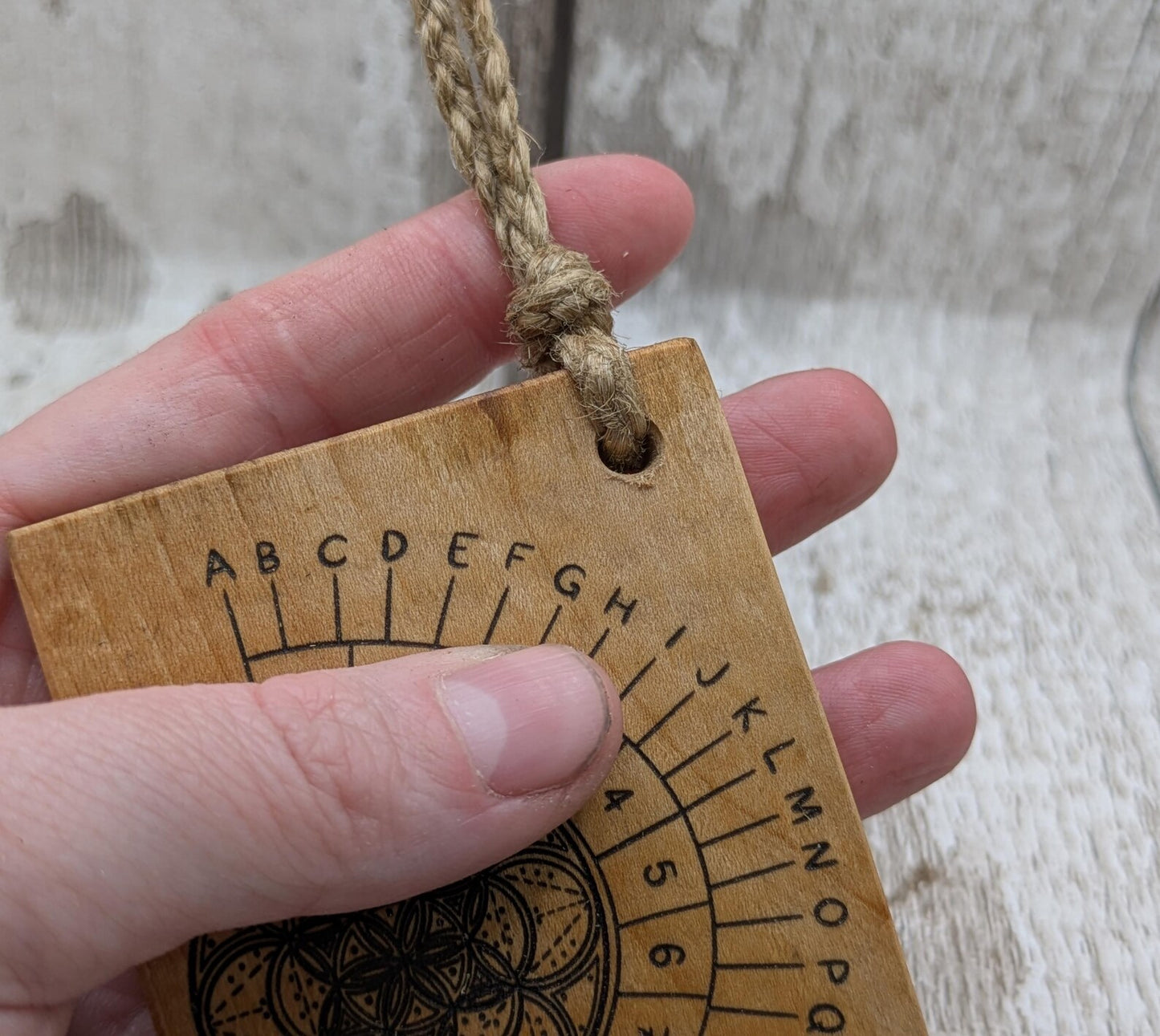 Alder wood mini pocket sized alphabet dowsing pendulum board.