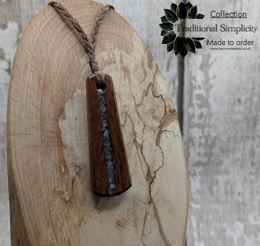 Made to order Sepele mahogany roimata teardrop pendant with blue kyanite inlay.