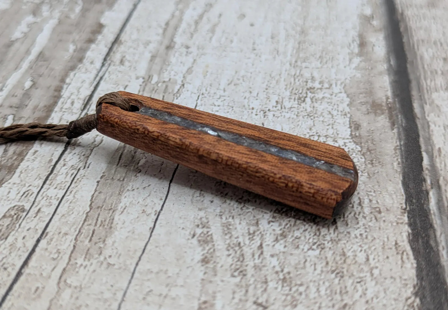 Made to order Sepele mahogany roimata teardrop pendant with blue kyanite inlay.