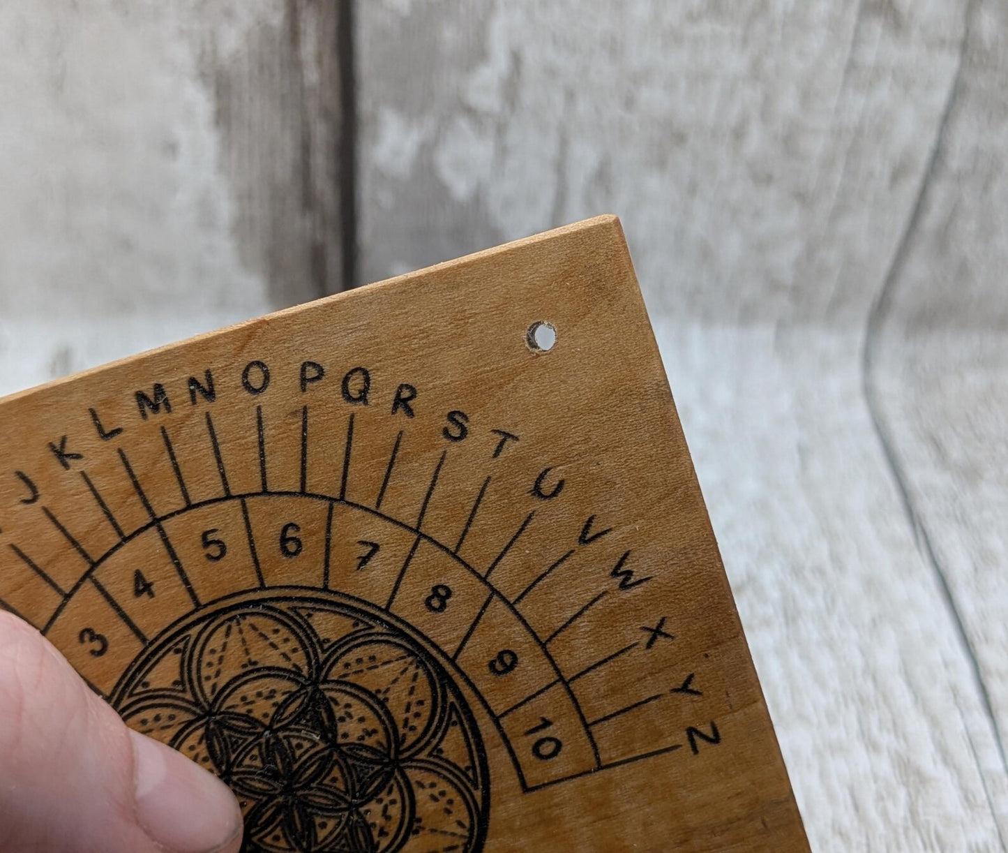 Alder wood mini pocket sized alphabet dowsing pendulum board.