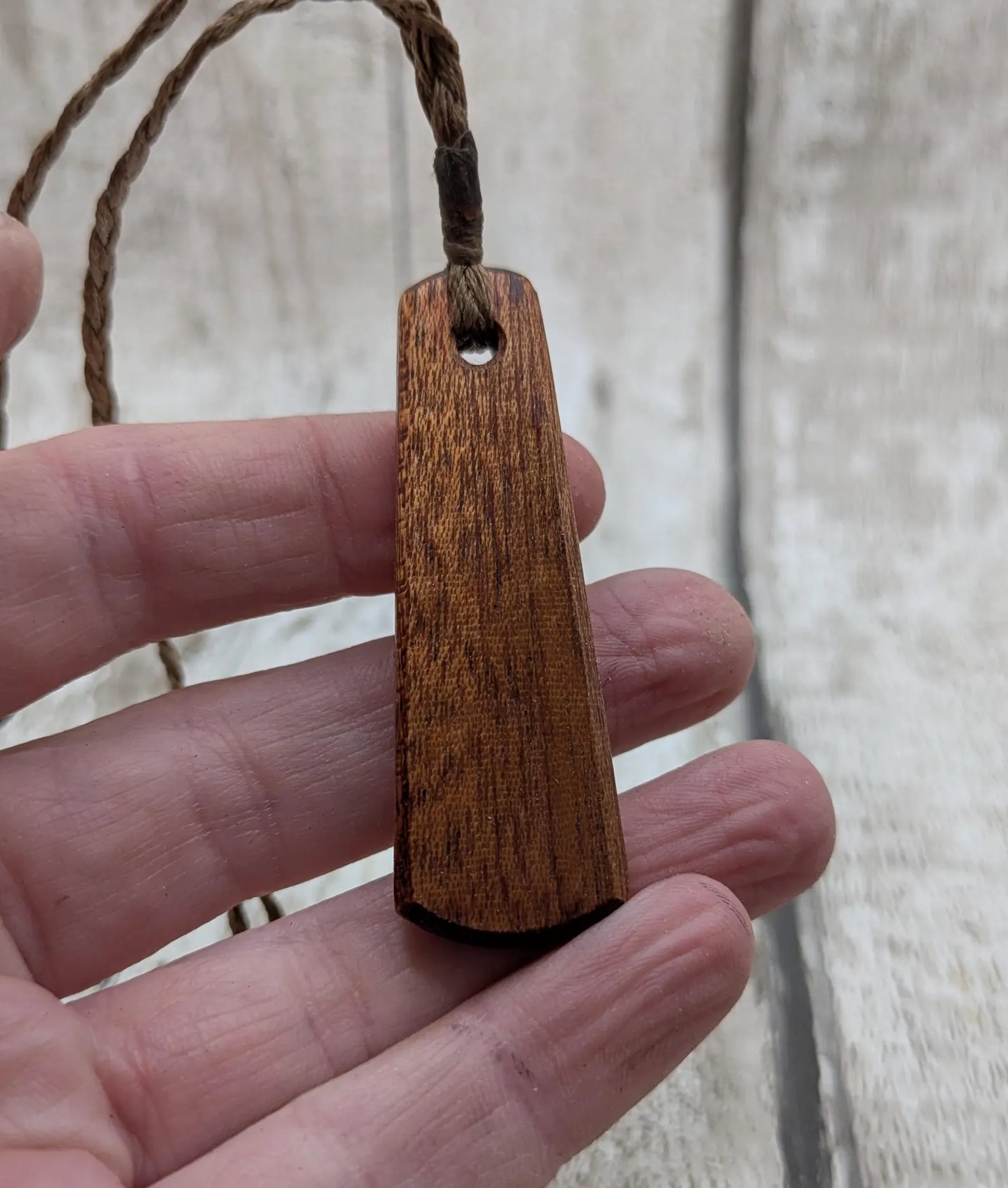 Made to order Sepele mahogany roimata teardrop pendant with blue kyanite inlay.