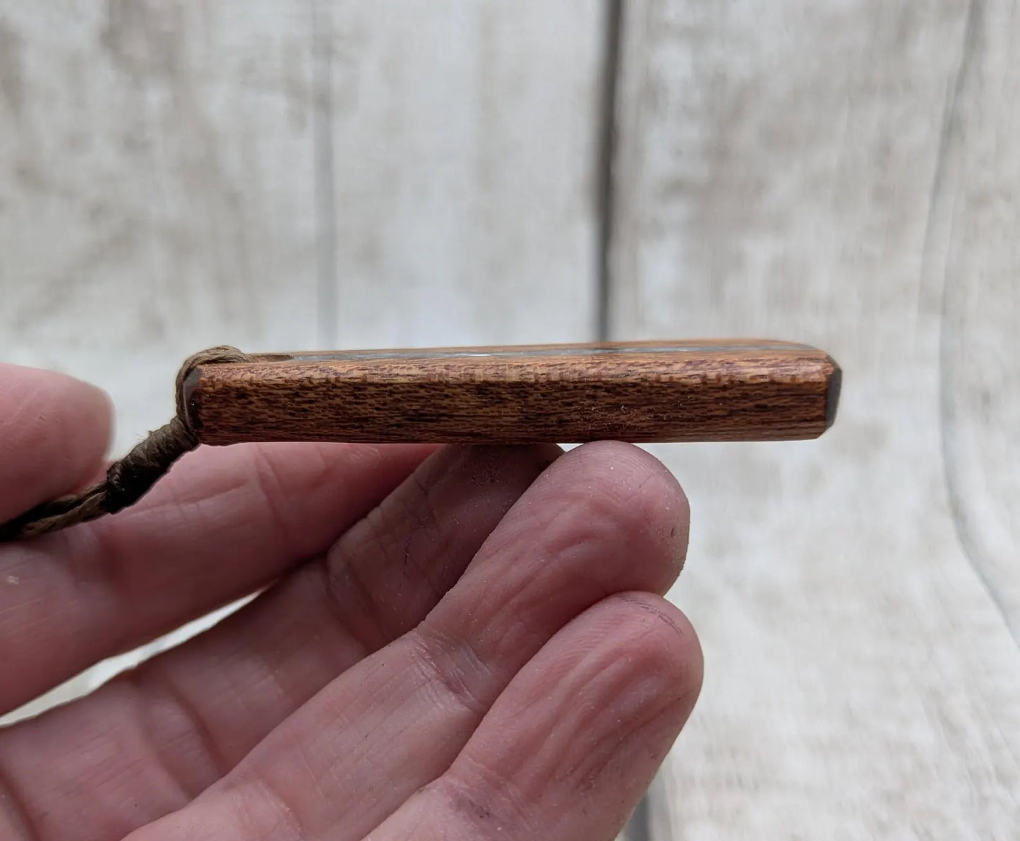 Made to order Sepele mahogany roimata teardrop pendant with blue kyanite inlay.