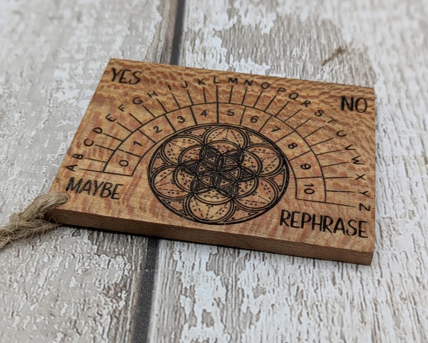 Lace wood mini pocket sized pendulum dowsing board.