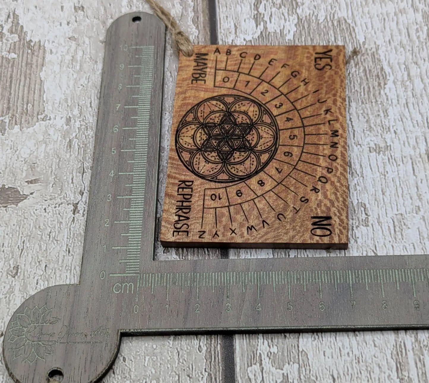 Lace wood mini pocket sized pendulum dowsing board.