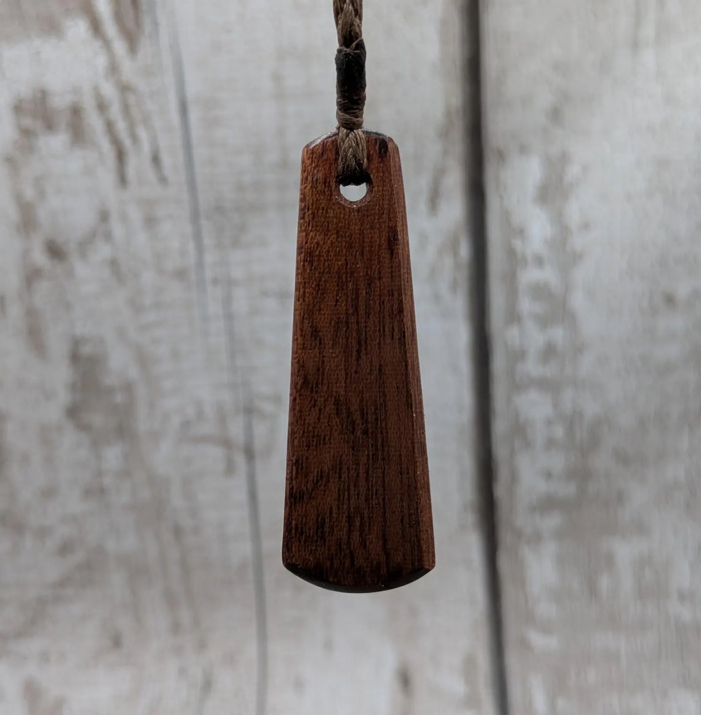 Made to order Sepele mahogany roimata teardrop pendant with blue kyanite inlay.
