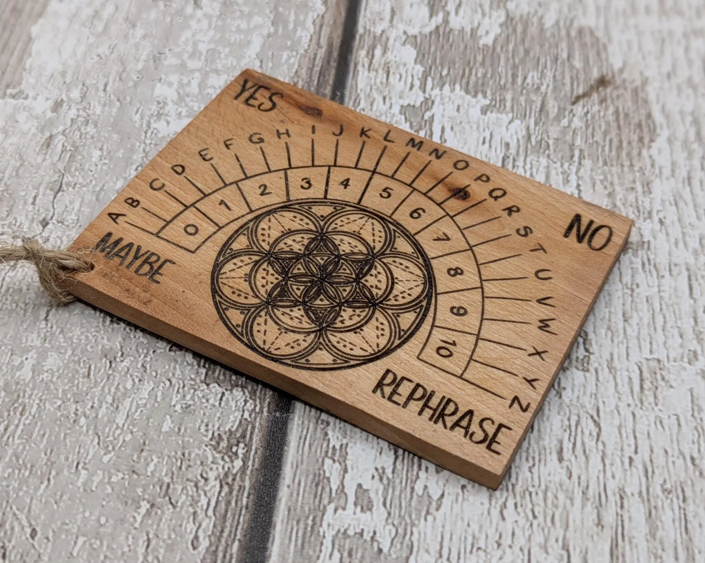 Pocket sized alder wood pendulum dowsing board.