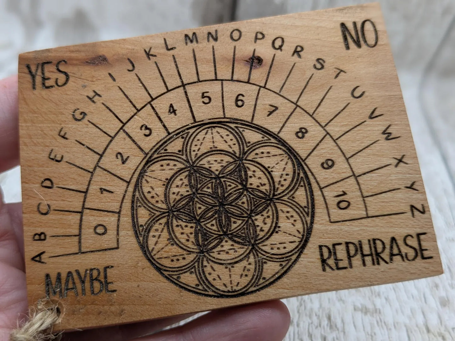 Pocket sized alder wood pendulum dowsing board.