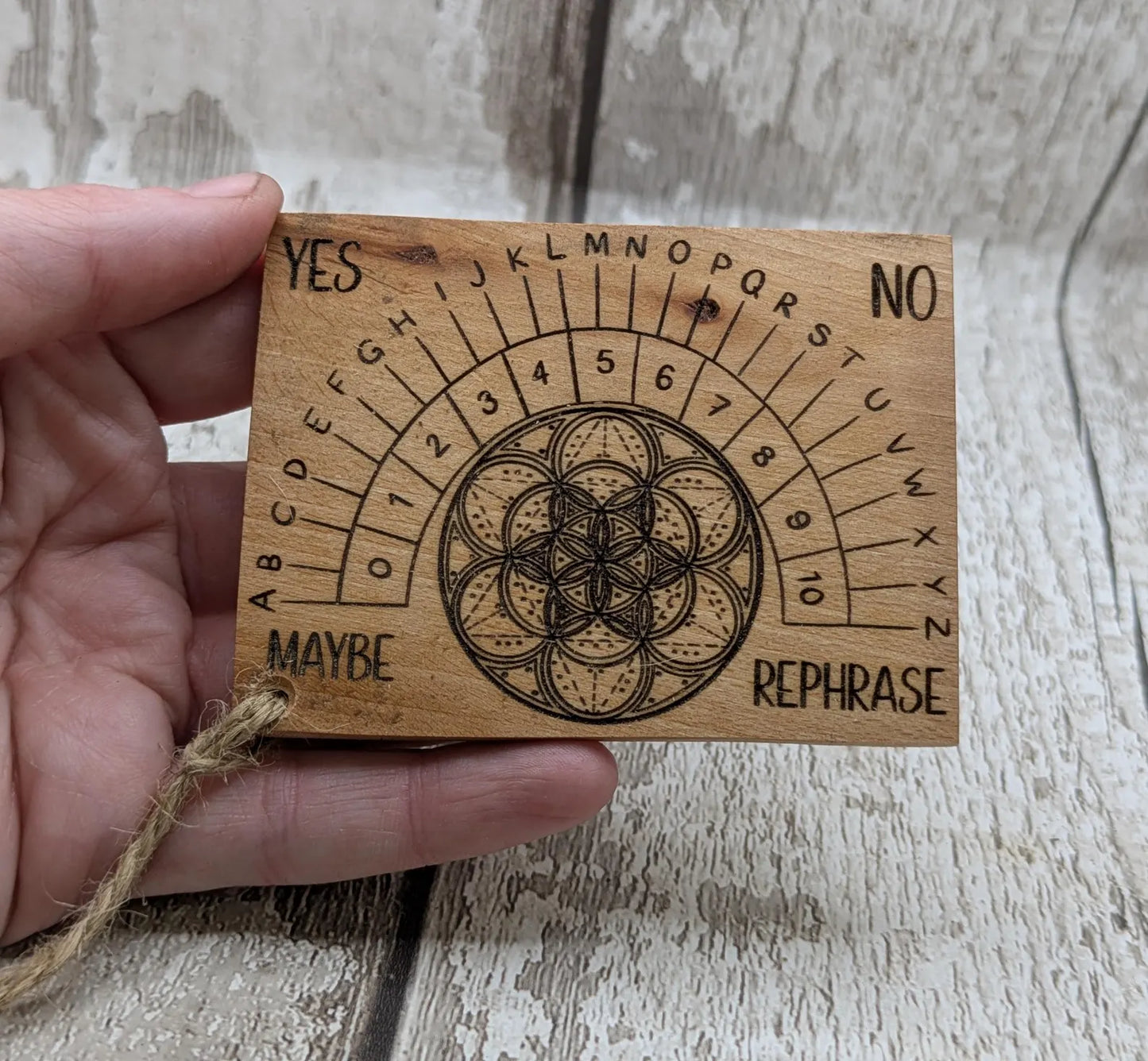 Pocket sized alder wood pendulum dowsing board.