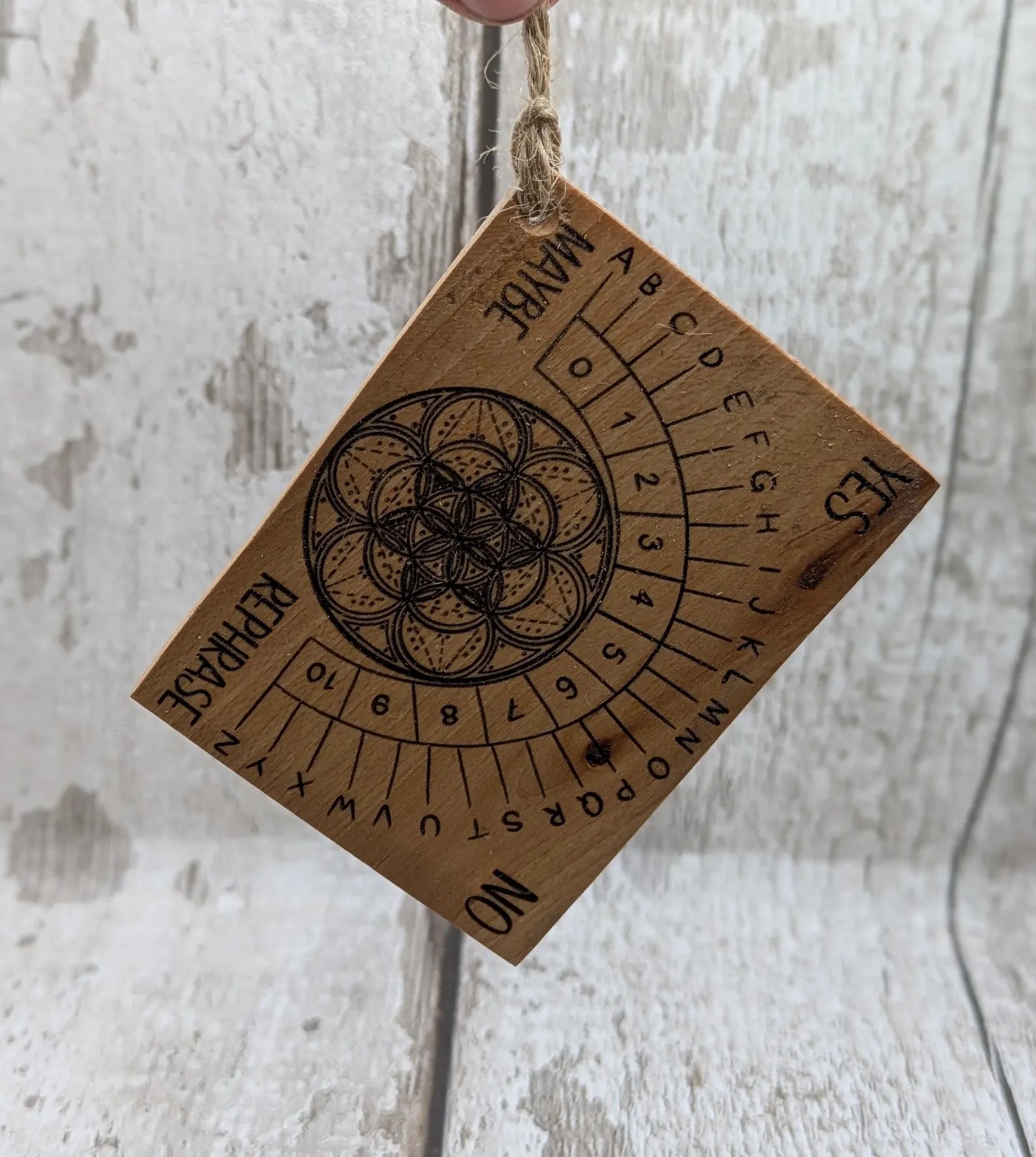 Pocket sized alder wood pendulum dowsing board.
