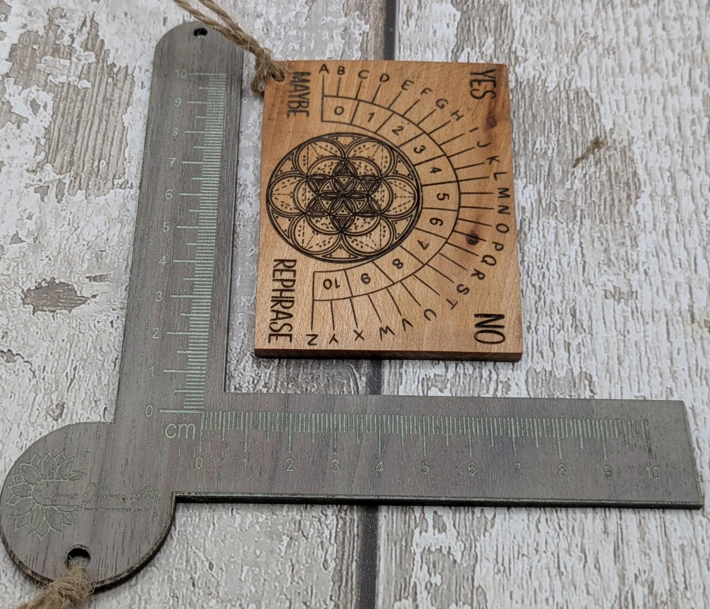 Pocket sized alder wood pendulum dowsing board.