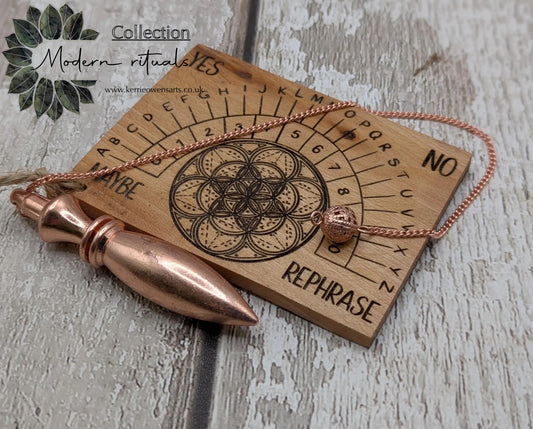 Pocket sized alder wood pendulum dowsing board.