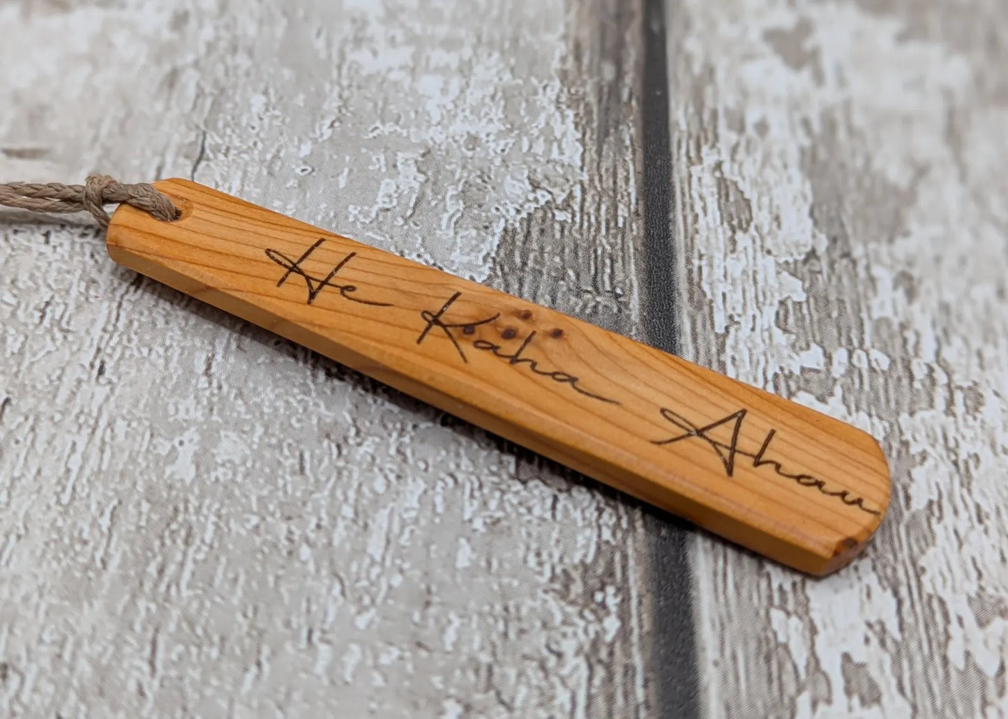 Yew wood roimata pendant with te reo māori He kaha ahau, I am strong.