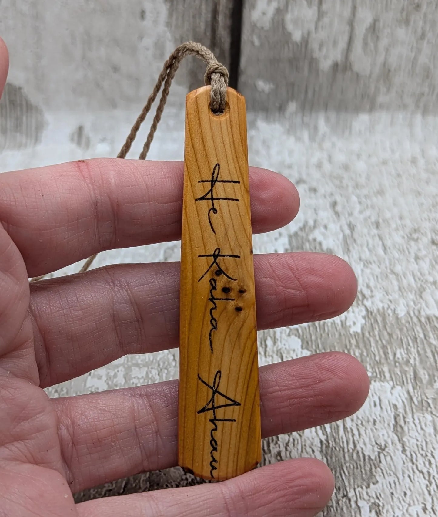 Yew wood roimata pendant with te reo māori He kaha ahau, I am strong.