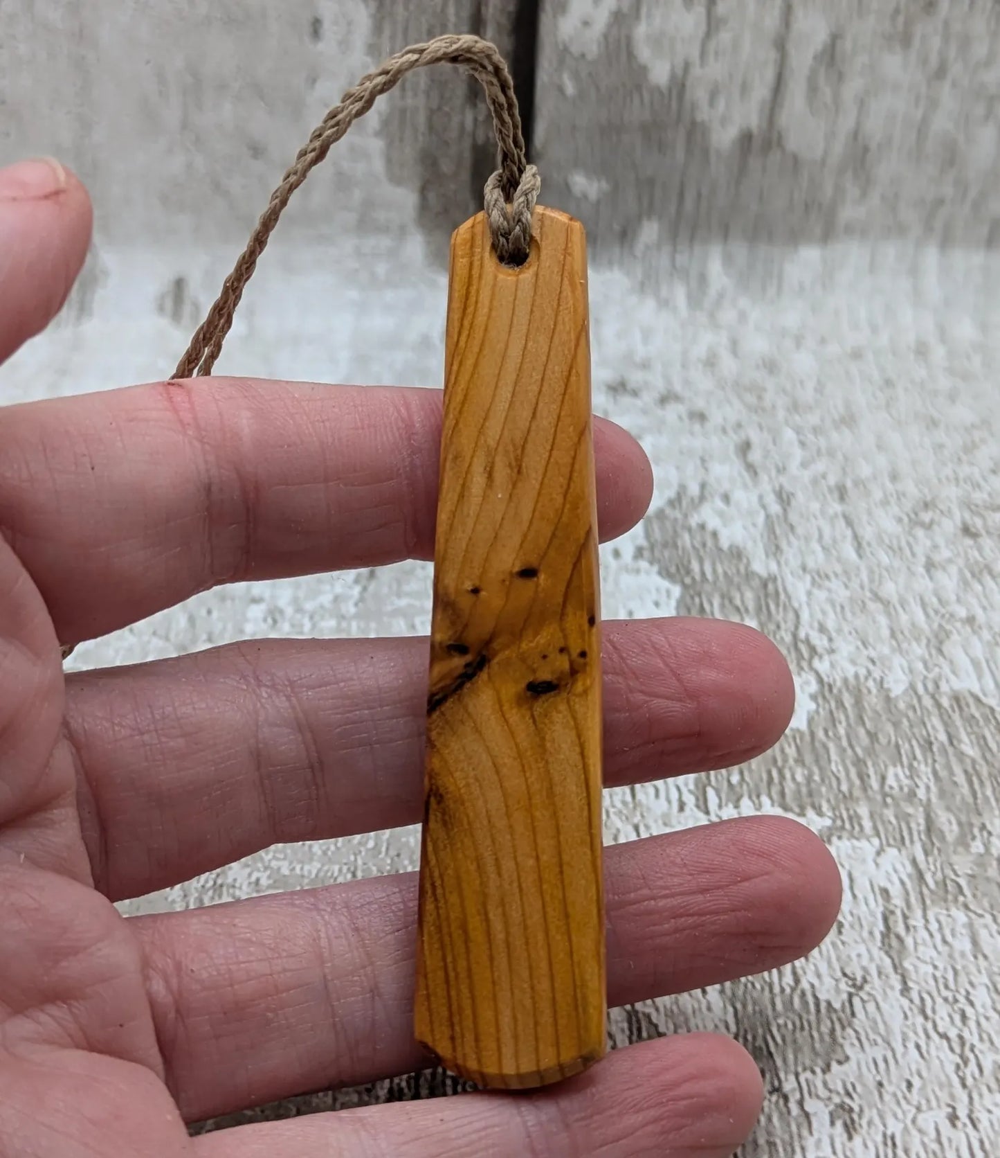 Yew wood roimata pendant with te reo māori He kaha ahau, I am strong.