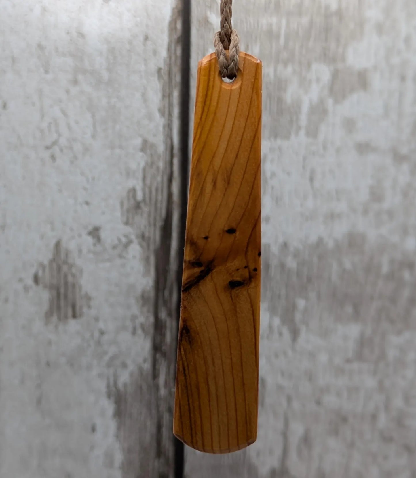 Yew wood roimata pendant with te reo māori He kaha ahau, I am strong.