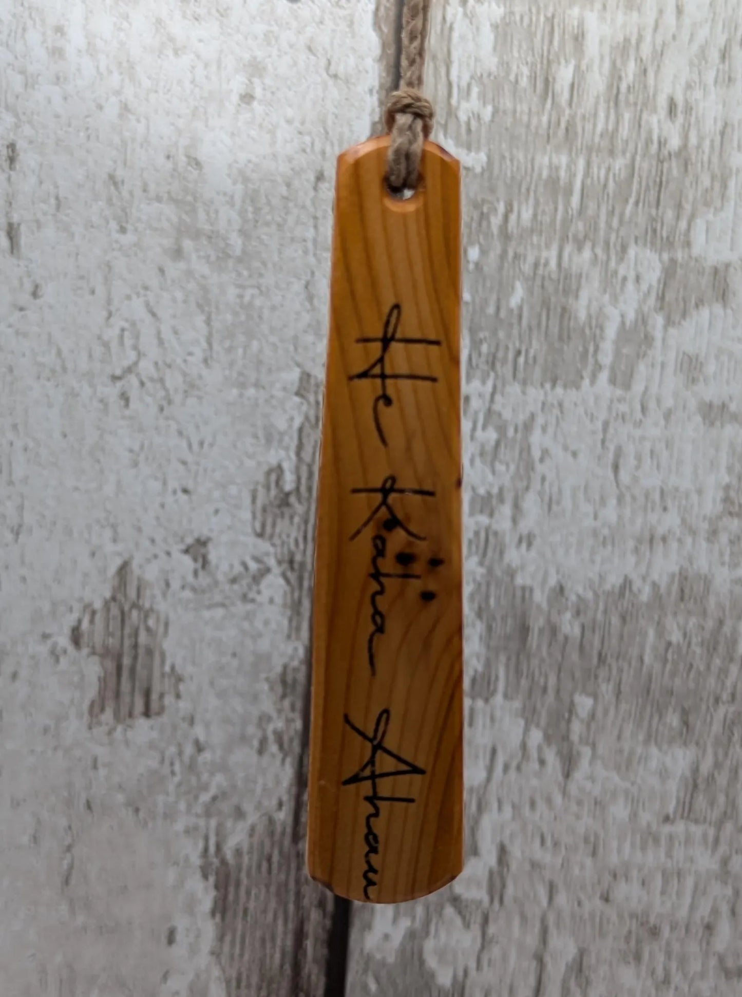 Yew wood roimata pendant with te reo māori He kaha ahau, I am strong.