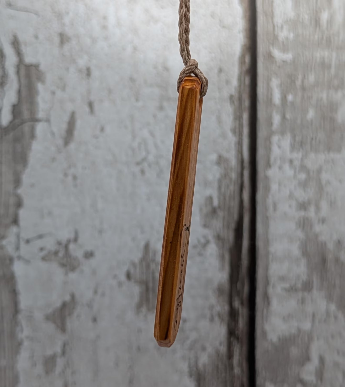 Yew wood roimata drop pendant with breathe mantra laser print.