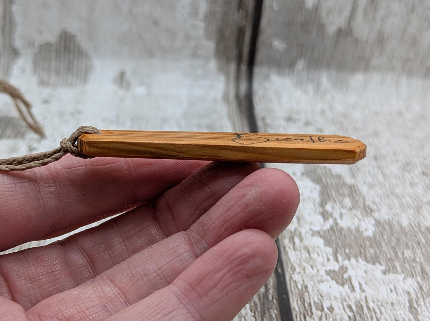 Yew wood roimata drop pendant with breathe mantra laser print.