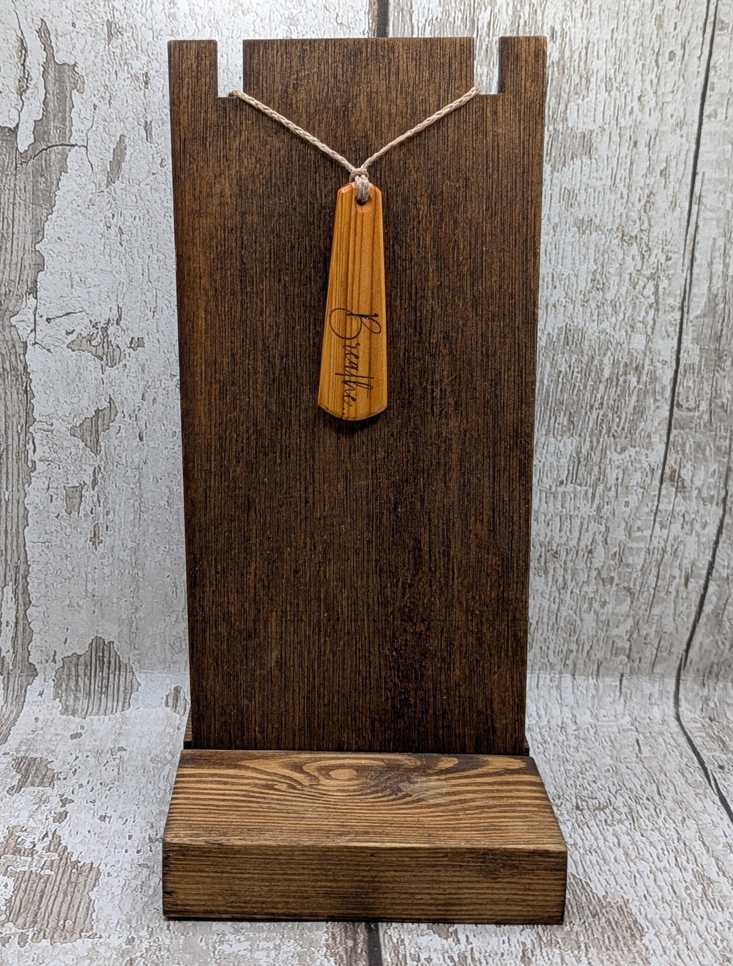 Yew wood roimata drop pendant with breathe mantra laser print.