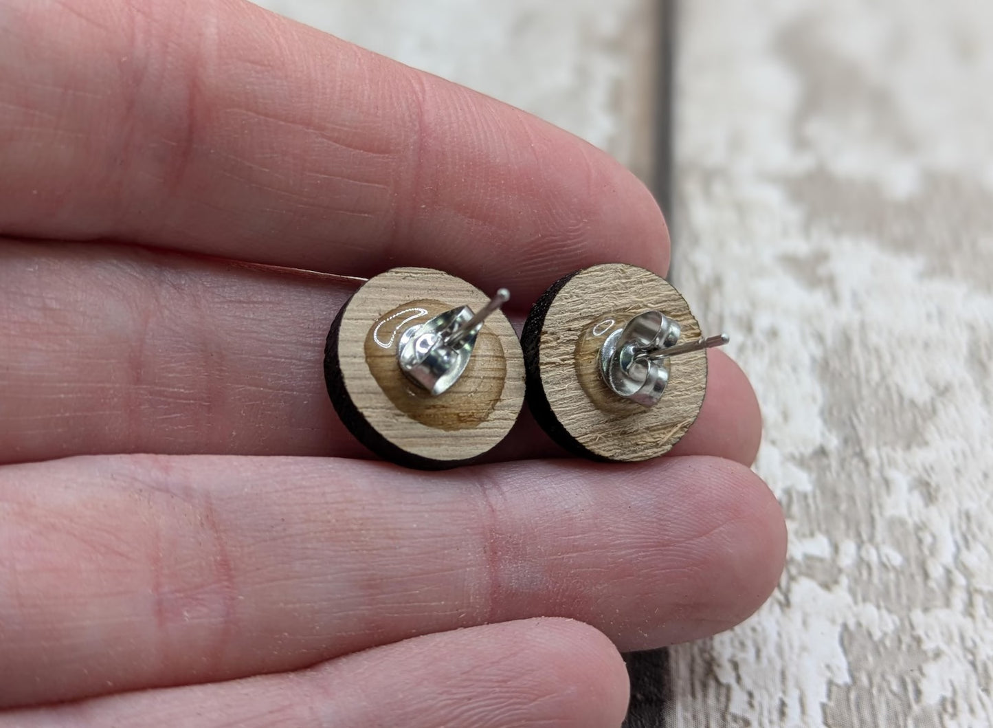 Sweet chestnut compass stud earrings with stainless steel findings.