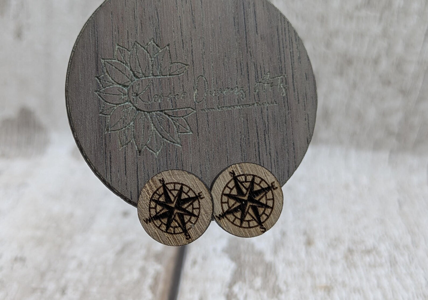 Sweet chestnut compass stud earrings with stainless steel findings.