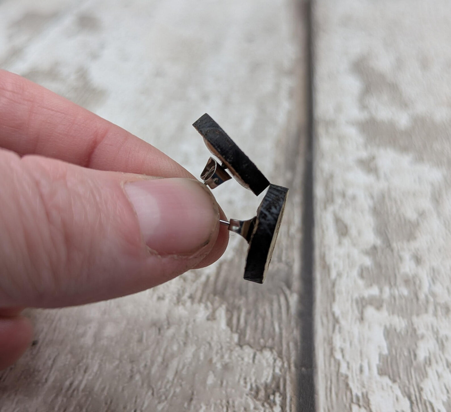 Sweet chestnut compass stud earrings with stainless steel findings.