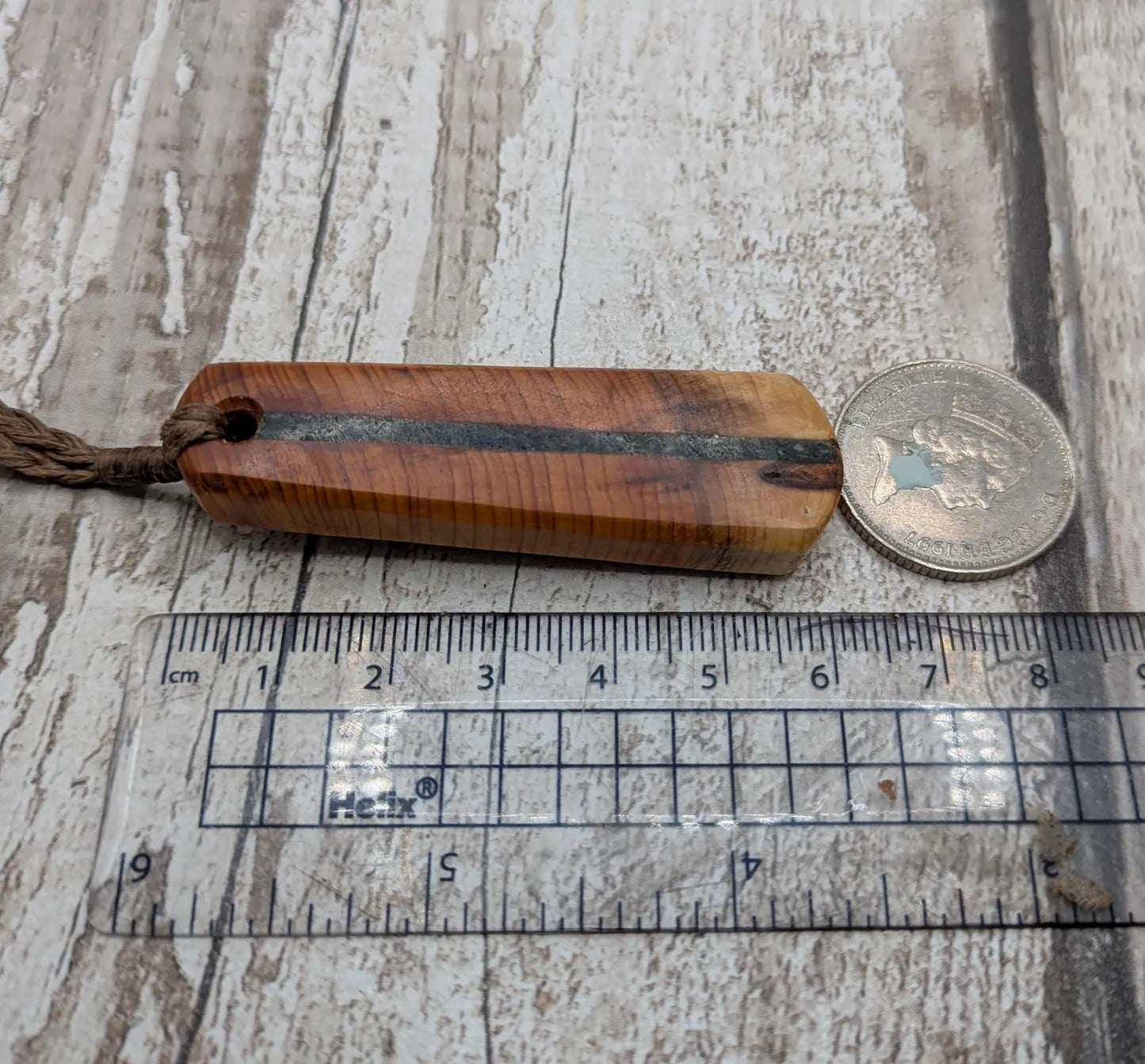 Yew wood roimata drop pendant with Aotea inlay.