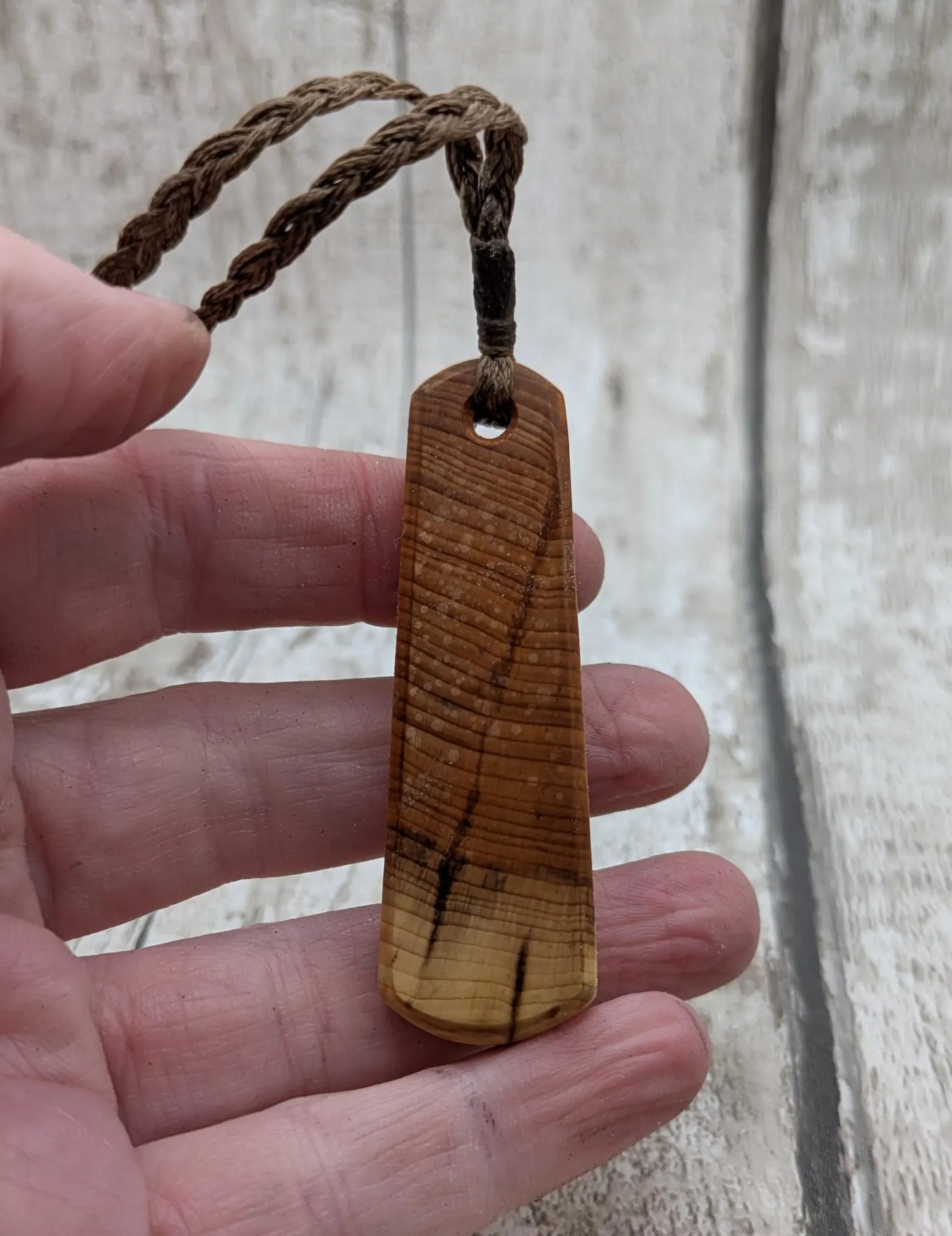 Yew wood roimata drop pendant with Aotea inlay.