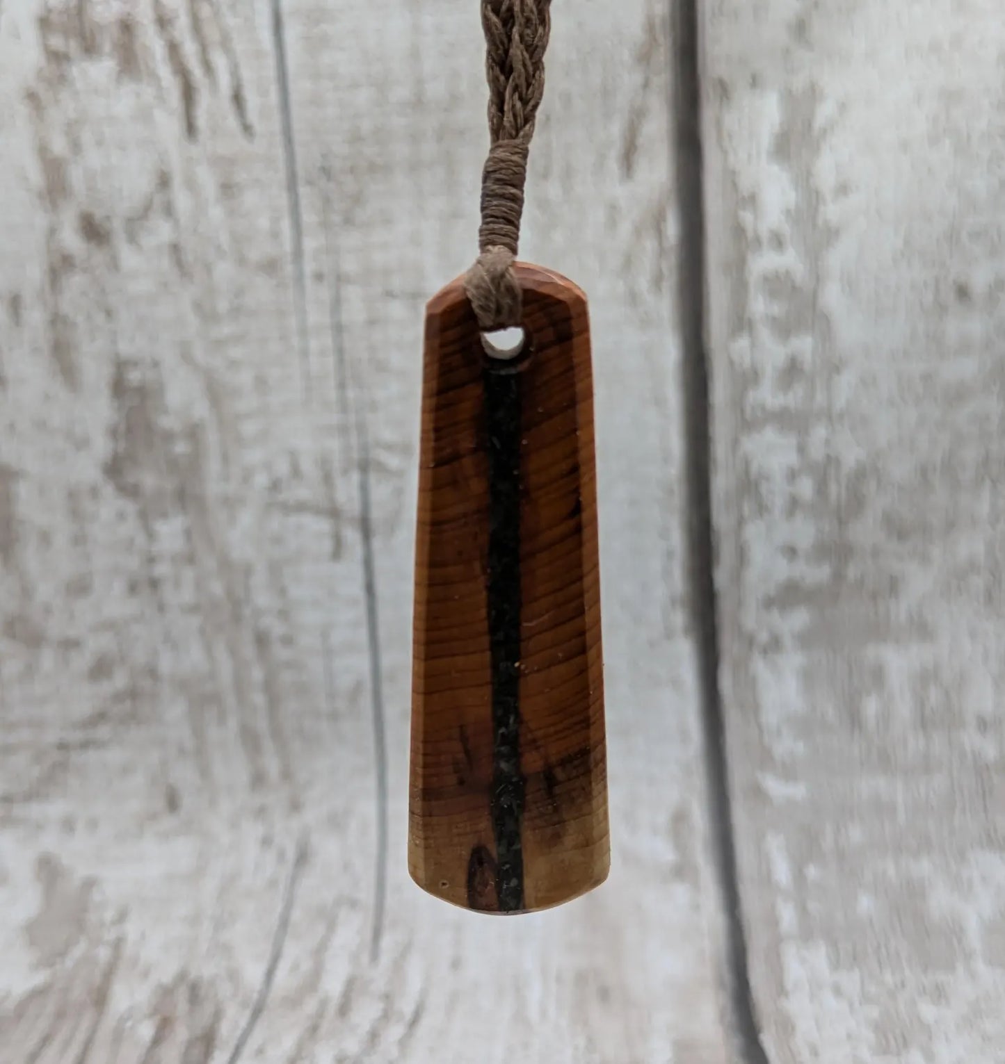 Yew wood roimata drop pendant with Aotea inlay.