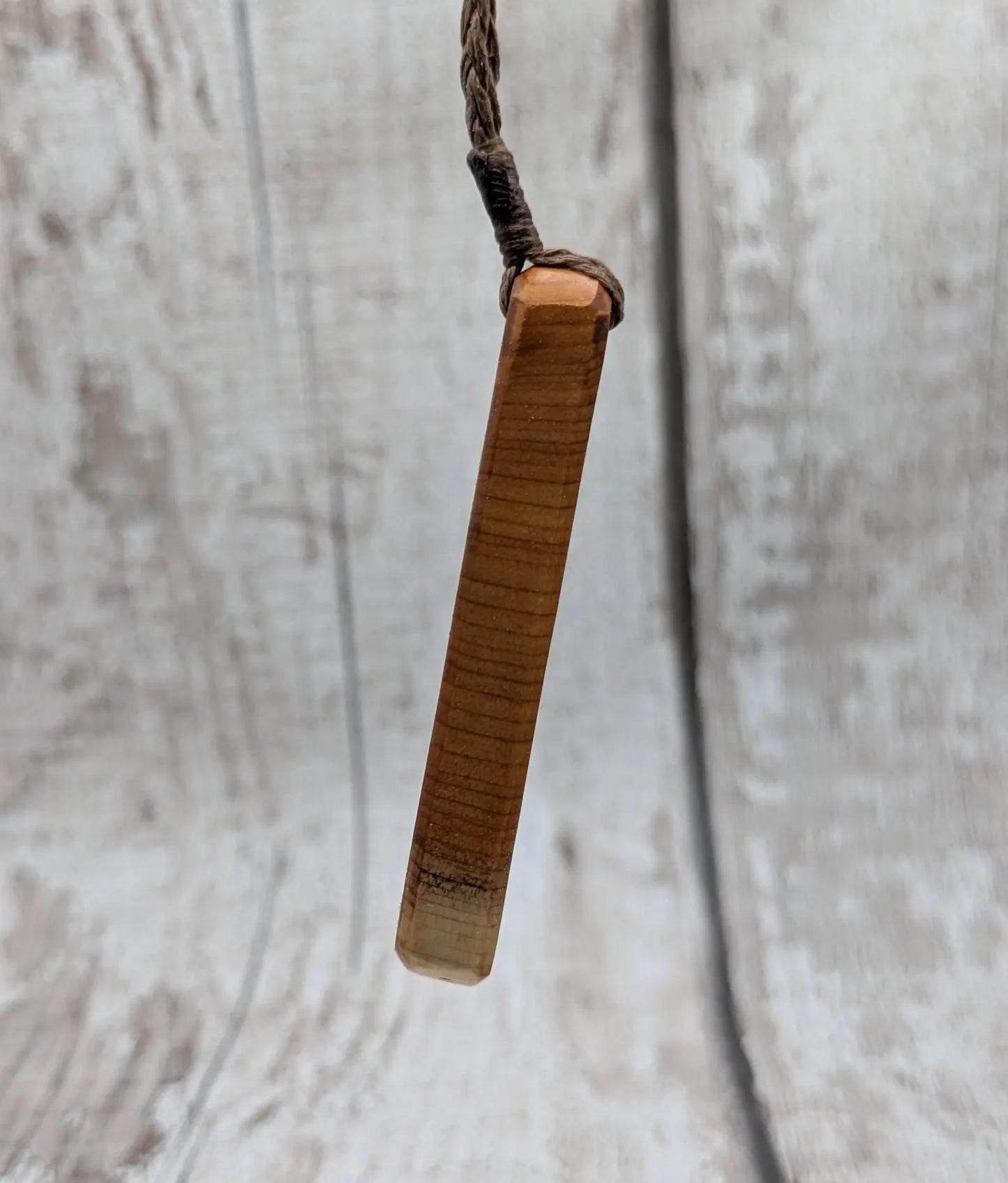 Yew wood roimata drop pendant with Aotea inlay.