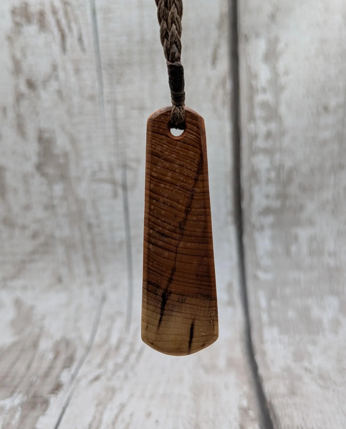 Yew wood roimata drop pendant with Aotea inlay.