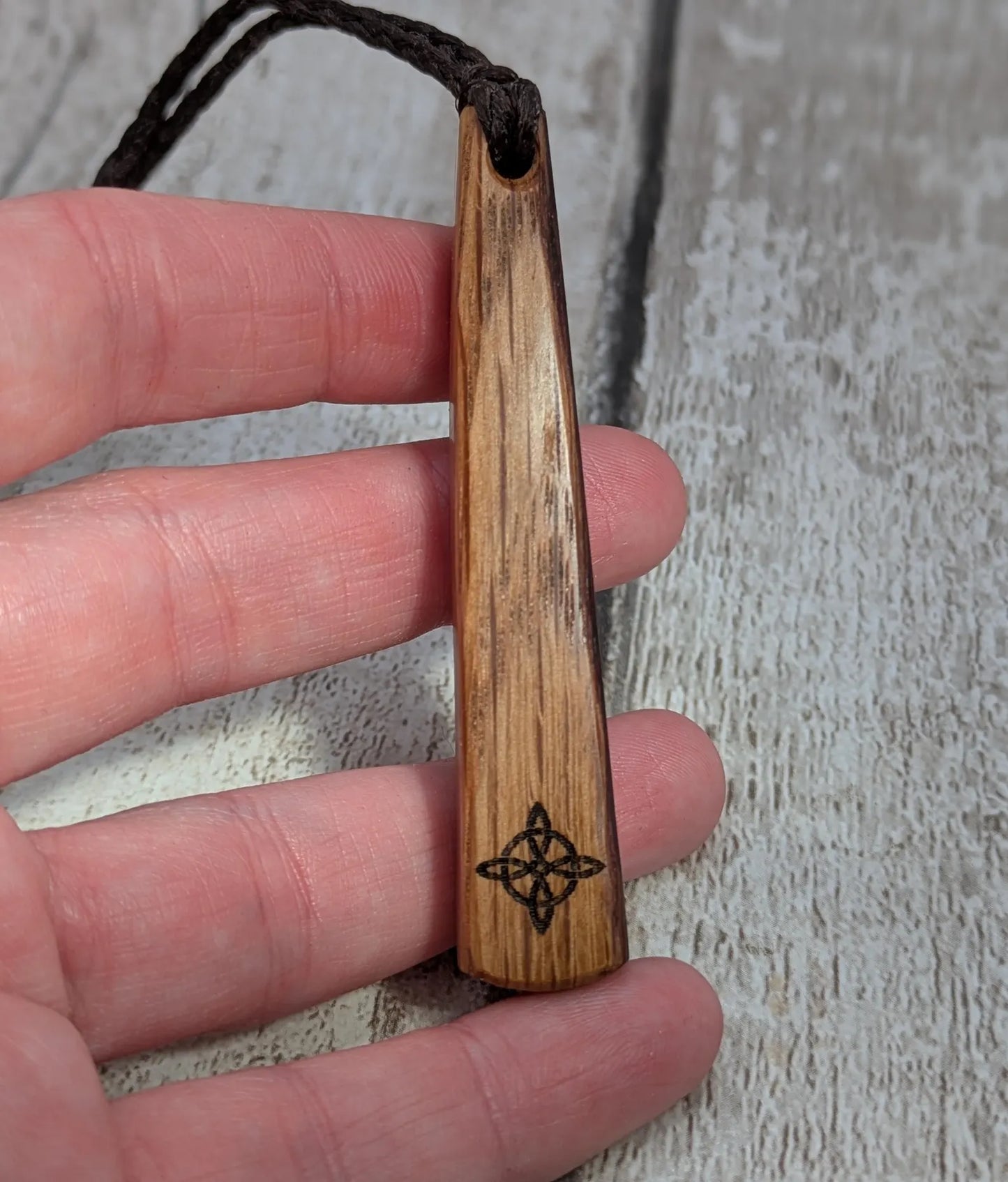 Whiskey barrel oak tear drop pendant with laser printed with rune symbol.