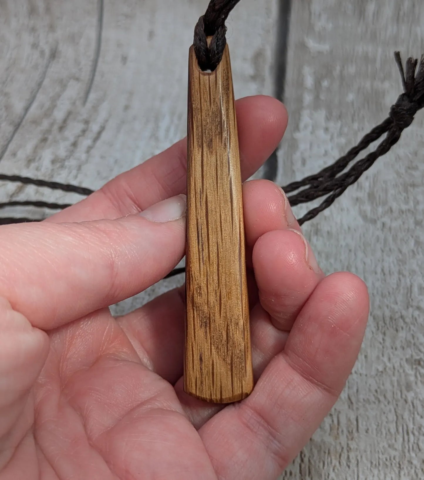 Whiskey barrel oak tear drop pendant with laser printed with rune symbol.