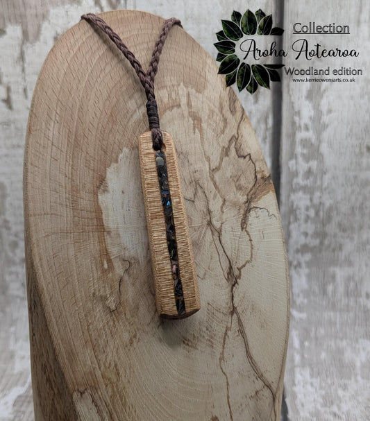 NZ Swamp Kauri wood pendant with rainbow pāua shell.