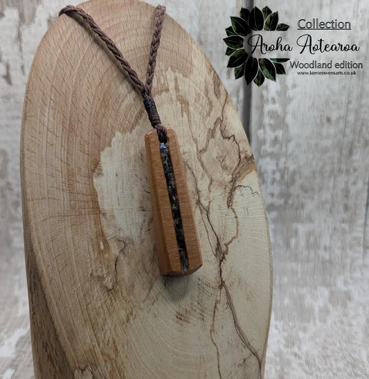 New Zealand swamp kauri with Rainbow Pāua shell.