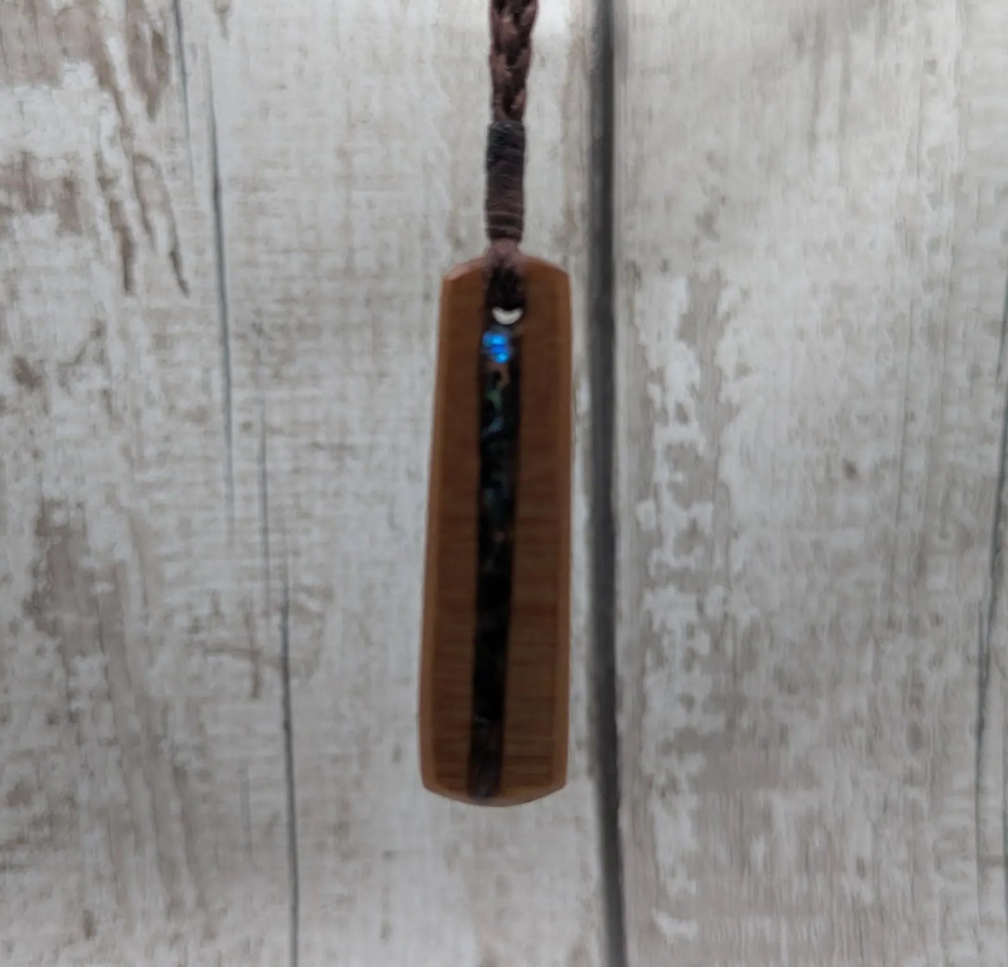 New Zealand swamp kauri with Rainbow Pāua shell.