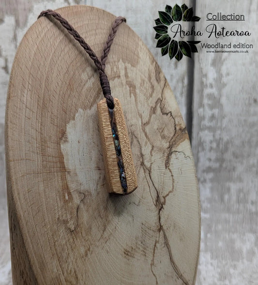 New Zealand swamp kauri roimata pendant with rainbow Pāua.