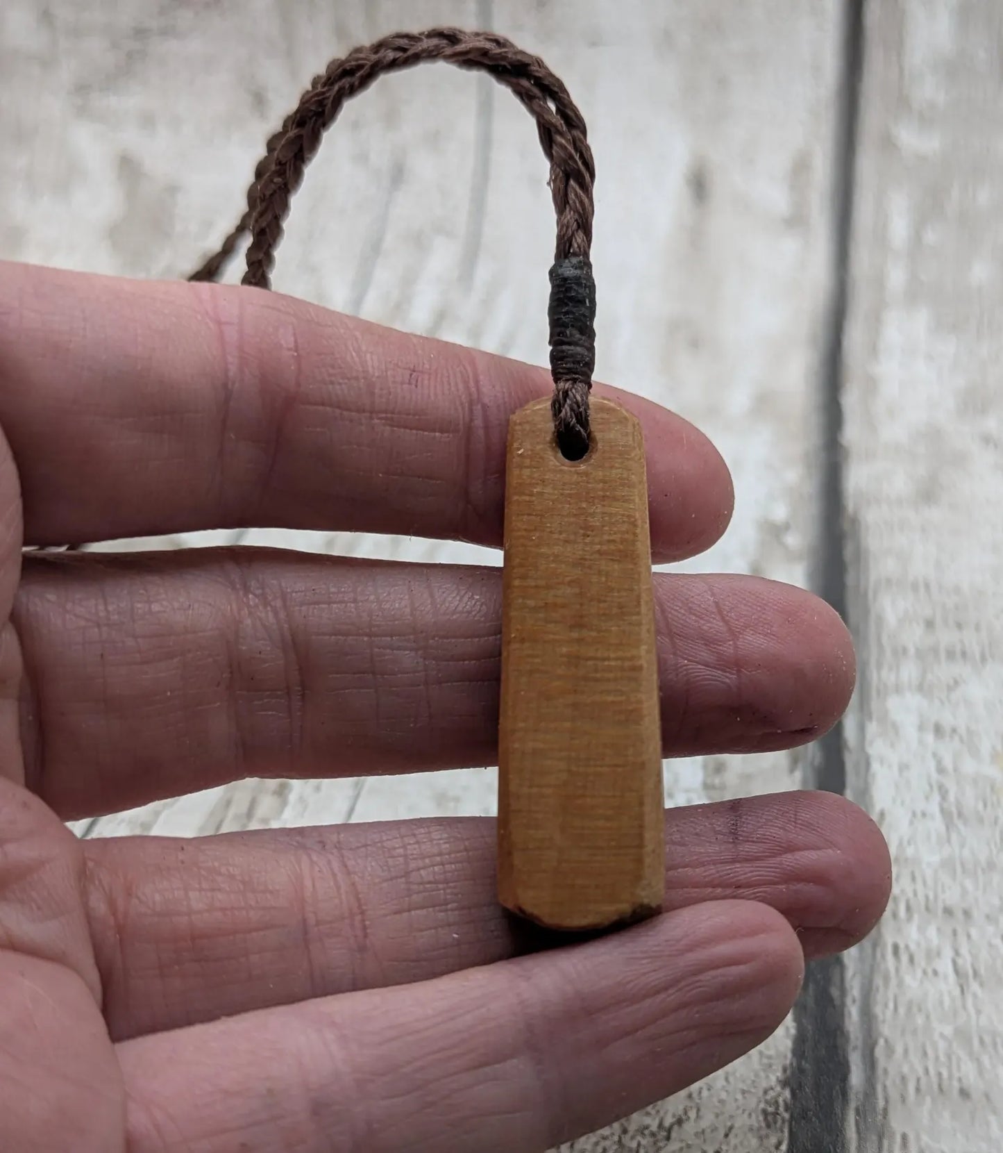 New Zealand swamp kauri roimata pendant with rainbow Pāua.