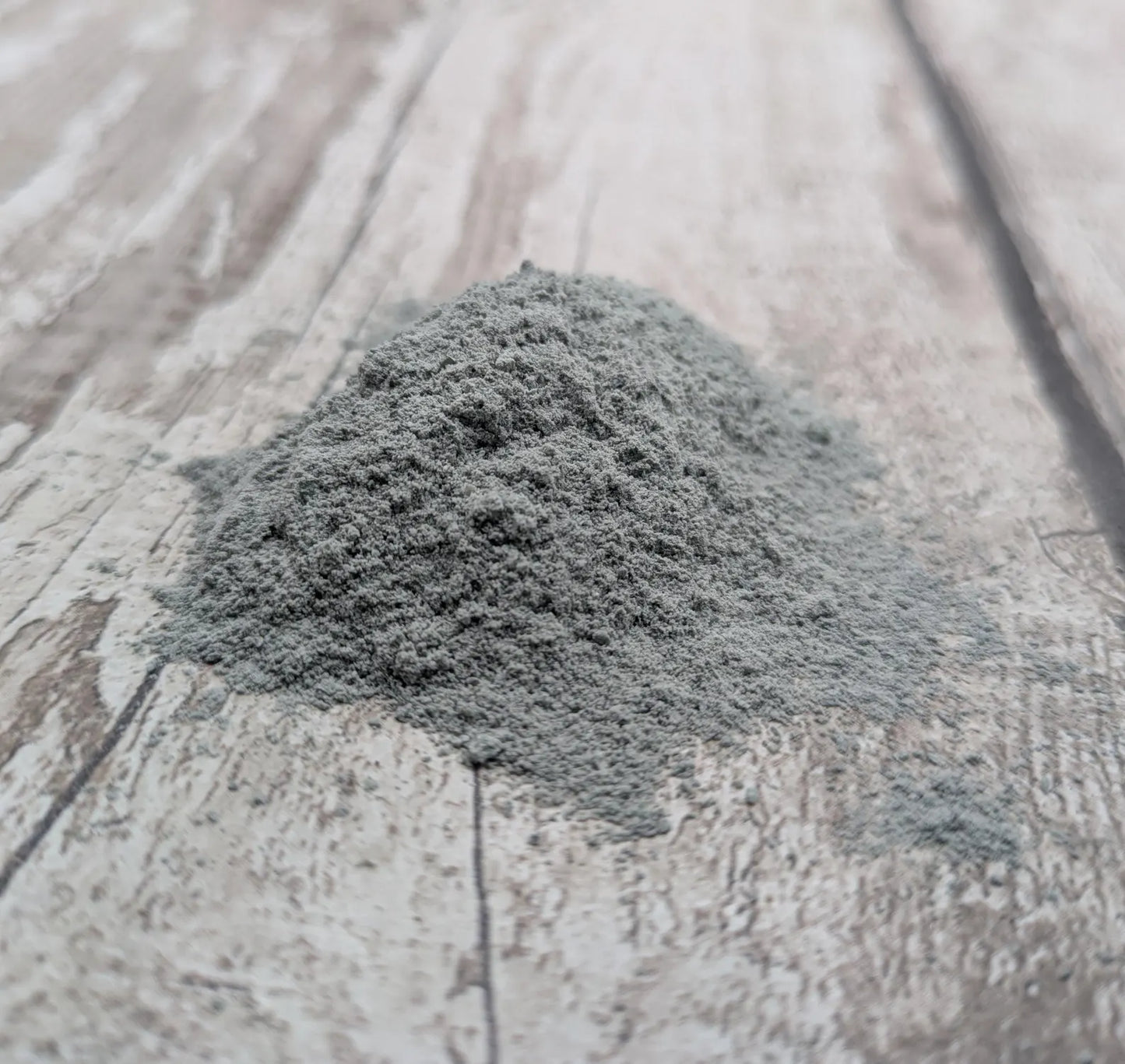 Unrefined powdered New Zealand Pounamu greenstone pigment.