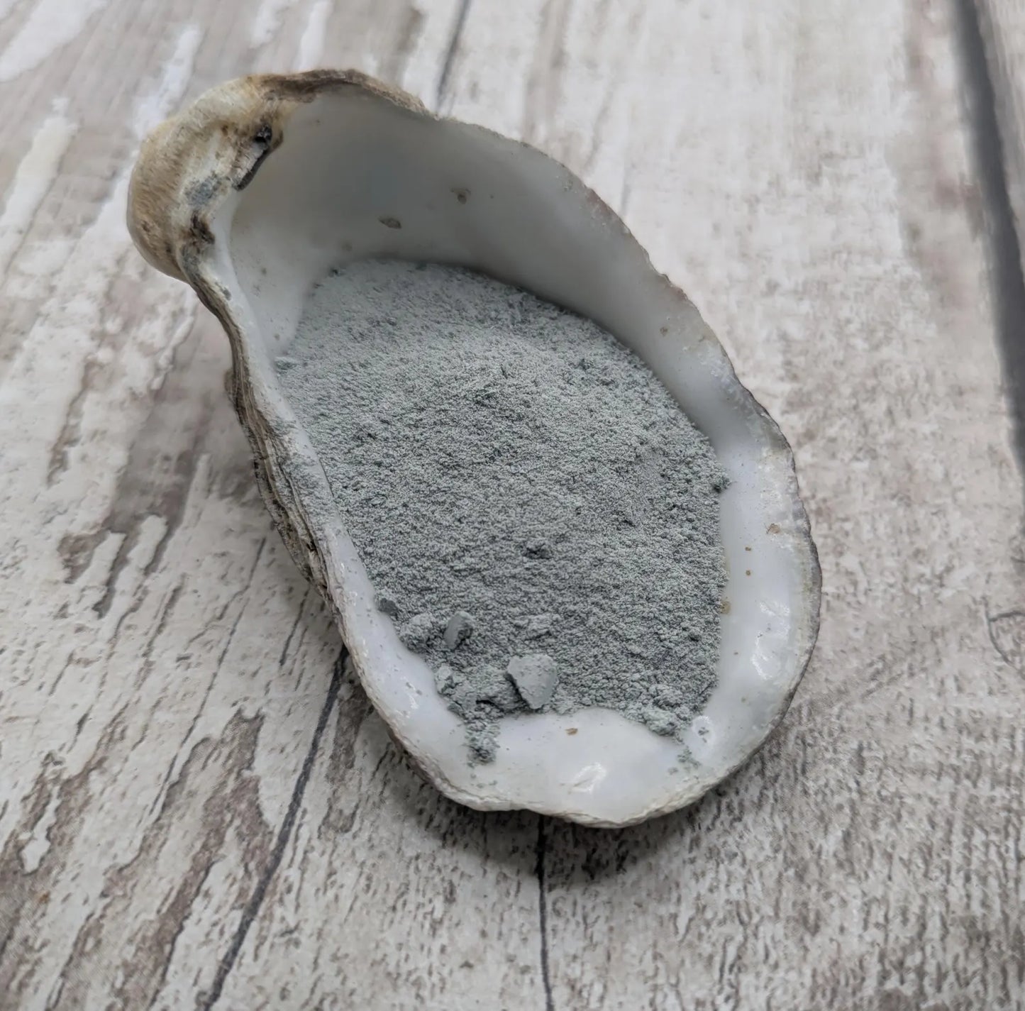 Unrefined powdered New Zealand Pounamu greenstone pigment.