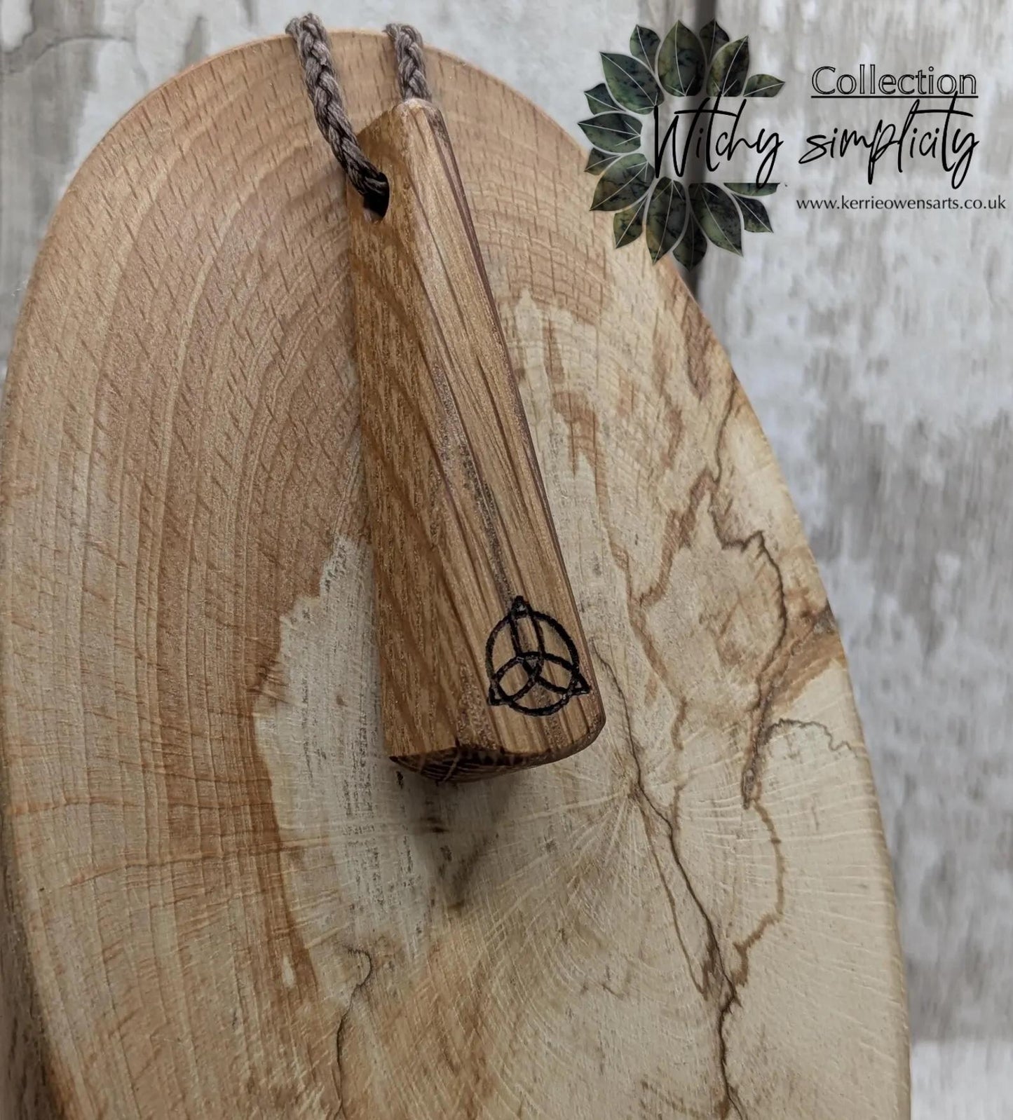 Whiskey barrel oak roimata tear drop triskele pendant.